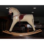A child's mid 20th century rocking horse, on cradle supports, 31" high
