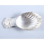 A silver caddy spoon with scallop shell handle and bowl, S J Rose & Son, Birmingham 1966, 2 3/4"