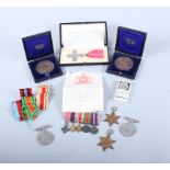 A group of WWII medals with corresponding miniatures, two early 20th century bronze medals, a