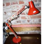 A retro orange painted Anglepoise type lamp