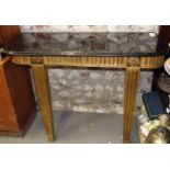 A pair of Georgian design giltwood console tables with black marble tops, on square fluted supports,