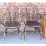 Two Windsor wheelback elbow chairs and a spindle back Windsor chair