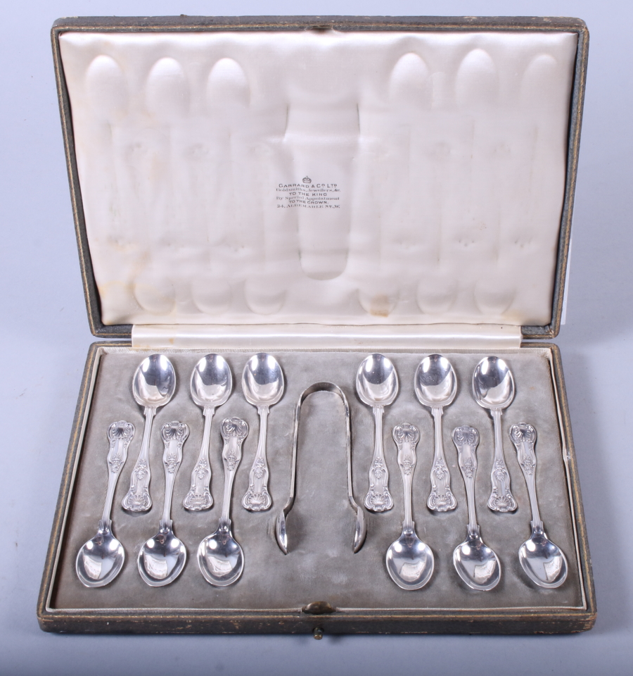 A set of twelve silver teaspoons and a matching pair of sugar tongs, William Hutton & Sons,