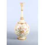 A Royal Worcester blush ivory porcelain bottle vase, painted with sprays of flowers, 13" high