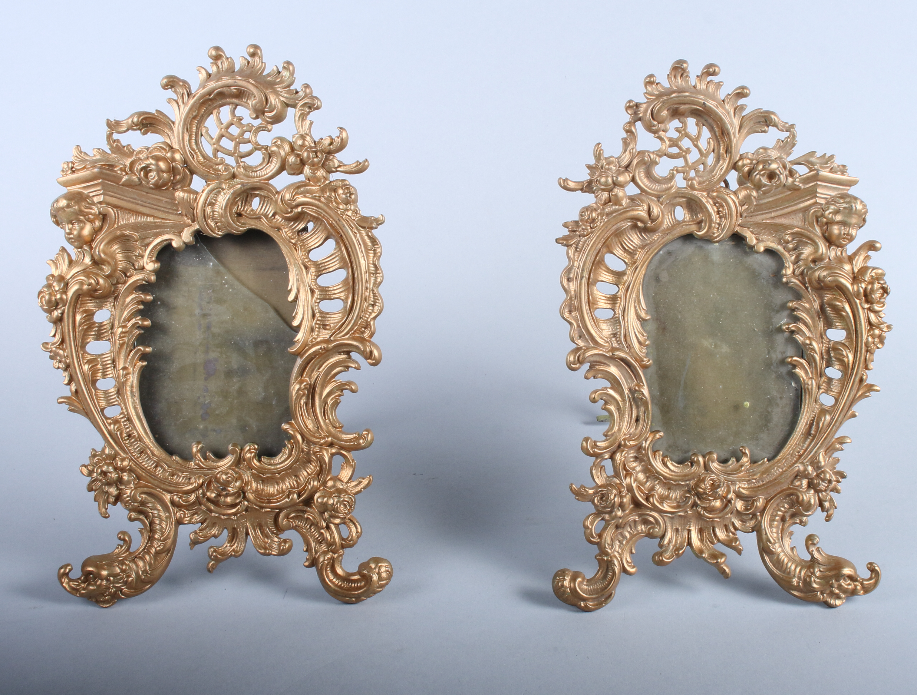 A pair of gilt metal photograph frames, 12" high