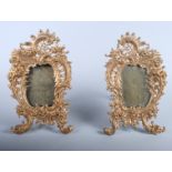 A pair of gilt metal photograph frames, 12" high