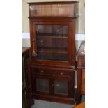 A late Victorian side cabinet, fitted lazed top over glass panel door and cupboards, on block