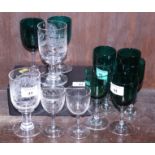 An assortment of early 20th century green wine glasses and other glassware