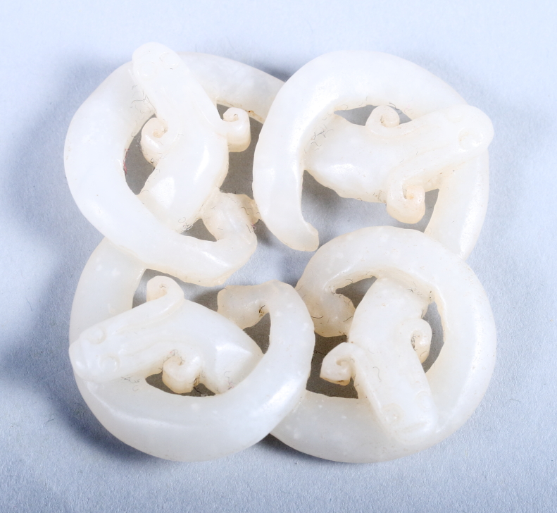 A 19th century? white jade brooch of four intertwining dragons, 1 3/4" wide