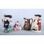 A Royal Doulton figure, "The Bedtime Story" HN2059, two 19th century Staffordshire Toby jugs and a