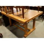 A mid 20th century Cotswold school design oak draw leaf table, on double stretcher and refectory