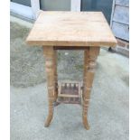 A walnut square top occasional table, on turned supports united by an undertier, 15" wide,