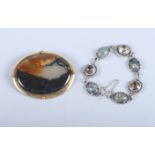 A yellow metal mounted agate brooch and a silver and hardstone set bracelet