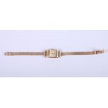 A lady's 14ct gold Eterna wristwatch with baton and Arabic numerals and chain strap