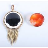 A yellow metal and polished agate brooch and a Victorian polished agate and gilt metal pendant