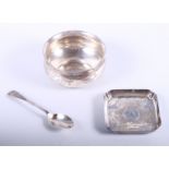 A commemorative silver coin dish, a silver bowl and a silver dessert spoon, 7.8 oz troy approx