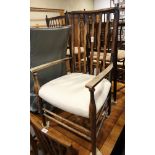 A pair of spindle back rush seat side chairs and a stick back elbow chair