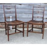 A pair of walnut pierced bar back side chairs with slatted seats