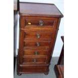 A 19th century mahogany bedside pot cupboard, fitted fall front and three drawers, on bun feet, 17