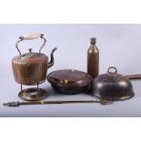 A copper warming pan, a copper kettle, a brass trivet and other metal wares