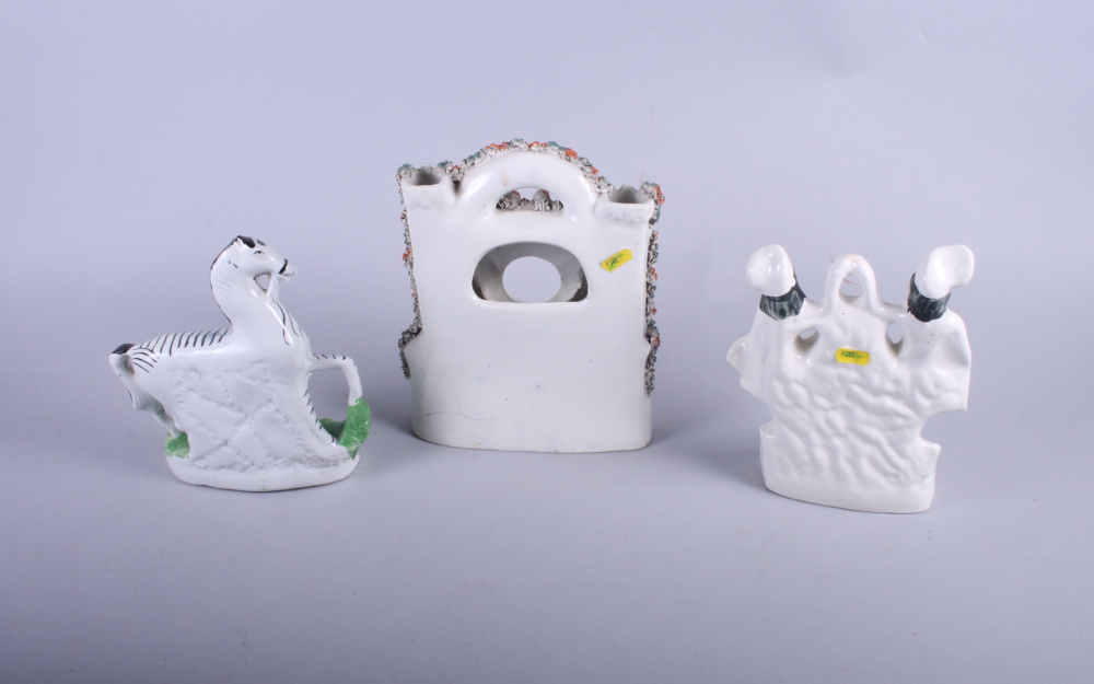 A Staffordshire model of a zebra, a Burns and Mary watch group and one other watch holder with - Image 2 of 3