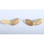 A pair of 18ct gold oval cufflinks with engine turned decoration, 10g