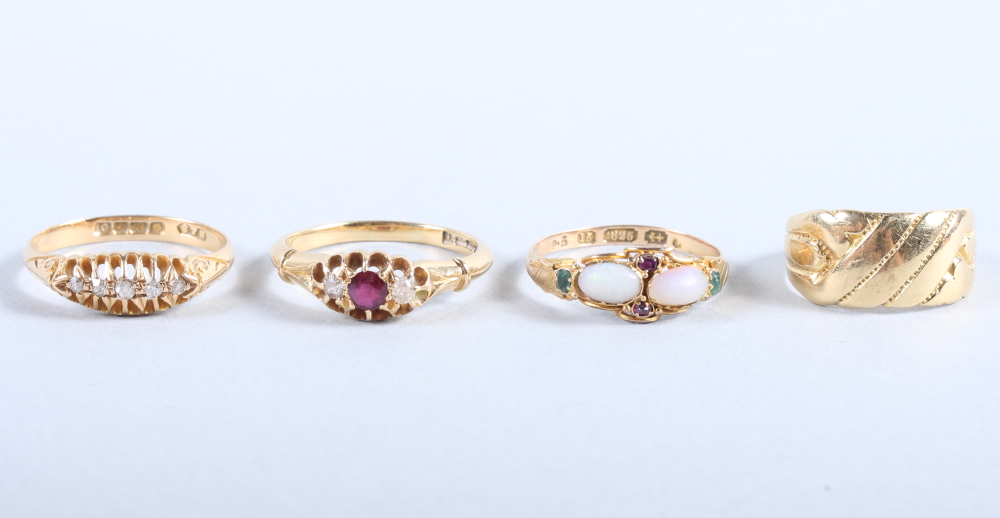 A late Victorian 15ct gold dress ring set opals emeralds and rubies, size M, 1.5g, together with two