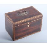 A Regency mahogany and strung two-division tea caddy with brass carrying handle, 8" wide