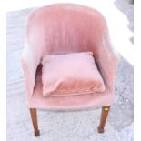 A 1930s oak framed tub chair, upholstered in a salmon velour