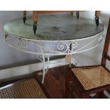 A wrought iron garden table with circular glass panel, 36" dia