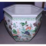 A Chinese porcelain famille rose hexagonal shaped fish bowl, decorated with pond and flowers, 15"