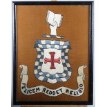 A silk embroidered panel, Millar coat of arms and motto, in strip frame