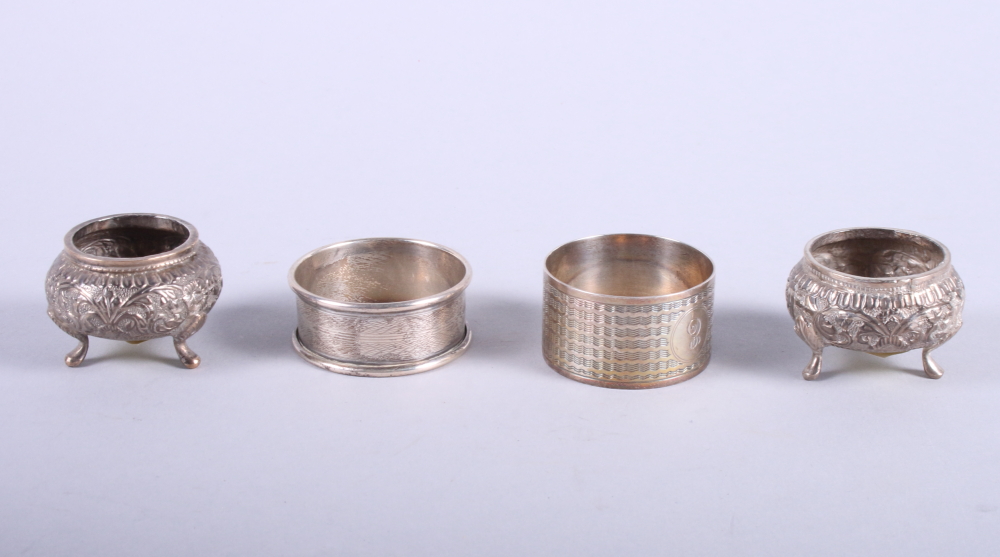 A pair of Indian silver salts and two silver napkin rings