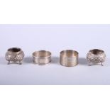 A pair of Indian silver salts and two silver napkin rings