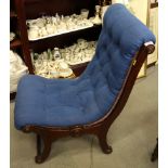 A late 19th century mahogany framed low seat nursing chair, button upholstered in a blue fabric