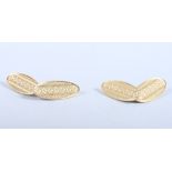 A pair of 18ct gold lozenge-shaped cufflinks with stylised engine turned decoration, 8g