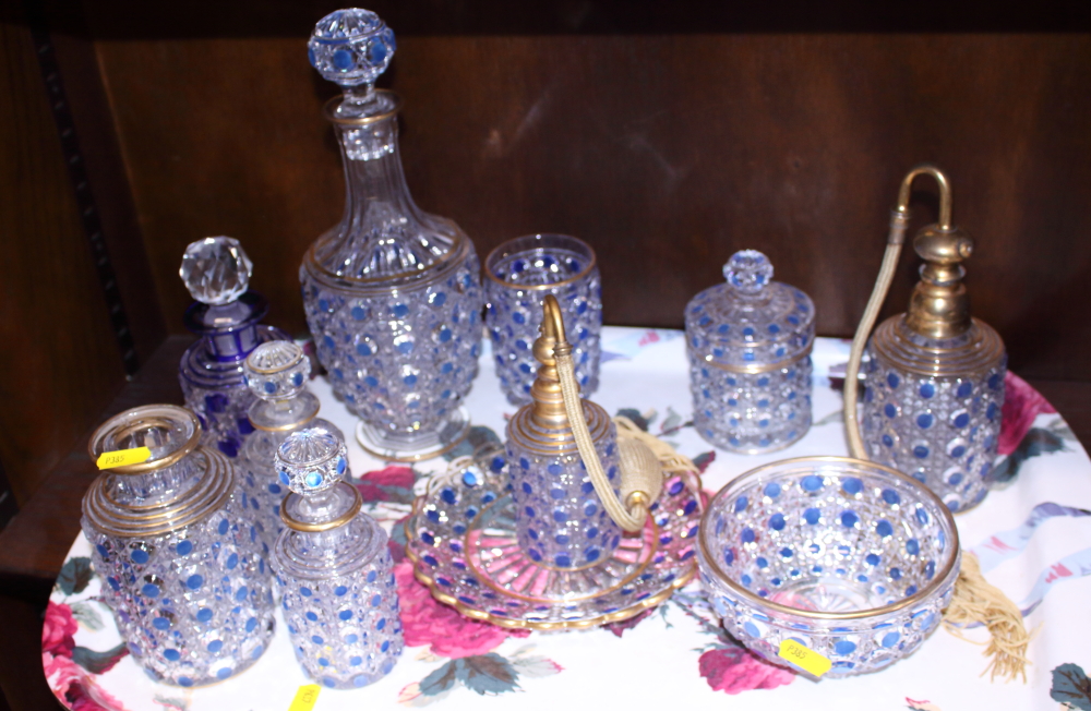 A quantity of moulded blue and clear glass dressing table appointments