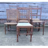 A pair of Georgian design mahogany ladder back dining chairs, upholstered in a brown leather, on