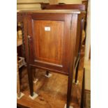 An Edwardian mahogany and satinwood banded bedside cupboard, on square taper supports, 18" wide