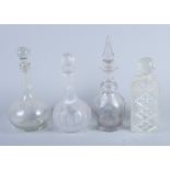 Three cut glass decanters and one other