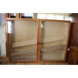 A golden oak wall mounted display cabinet enclosed two doors, 45" wide