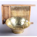 A 19th century brass cream bowl together with a pine and brass Northern Queen washing board