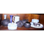 A collection of Wedgwood jasperware, including commemorative tankards, trinket dishes and a black