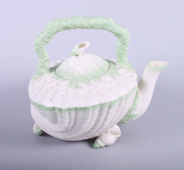 A Belleek porcelain (2nd period black mark) "Neptune" teapot, modelled in the form of a shell