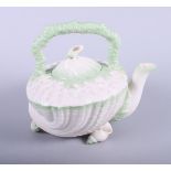 A Belleek porcelain (2nd period black mark) "Neptune" teapot, modelled in the form of a shell
