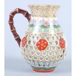 A Chamberlain's Worcester double walled reticulated baluster shaped jug with faux bamboo handle, 4