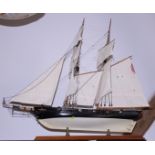 A scale wooden model of an American single decked two-masted warship, 34" long