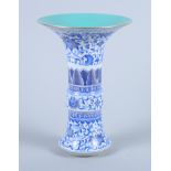 A Chinese Ming design blue and white porcelain Gu vase, with lotus leaf and scroll decoration,