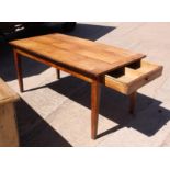 A French fruitwood dining table with cleated ends and end drawer, on square tapered supports, 60"