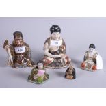 Two late 19th century Chinese nodding Buddhas and three Japanese Satsuma design figures